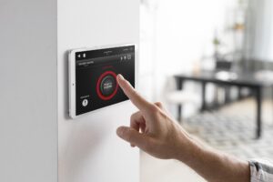 A person activating an alarm system