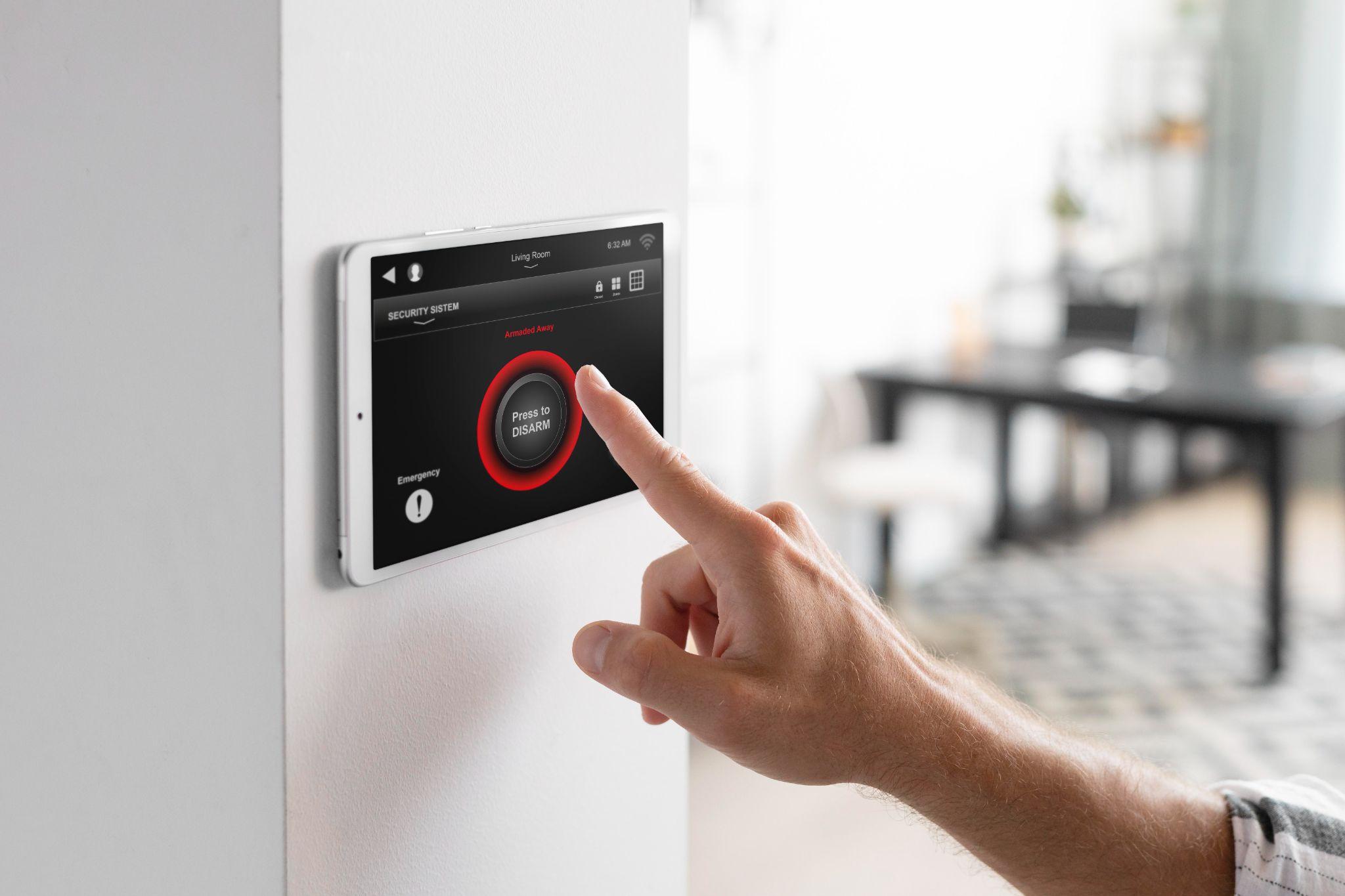 A person using their alarm System