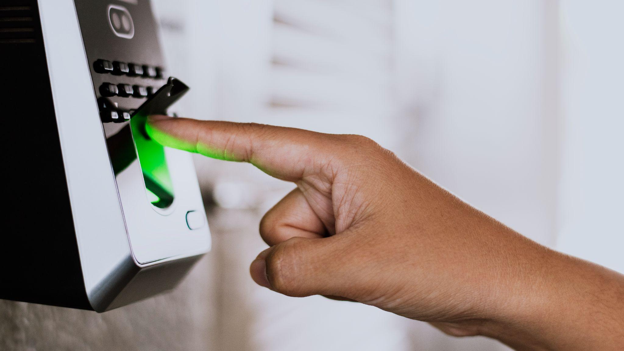  A person’s finger being scanned for a biometric access control system.