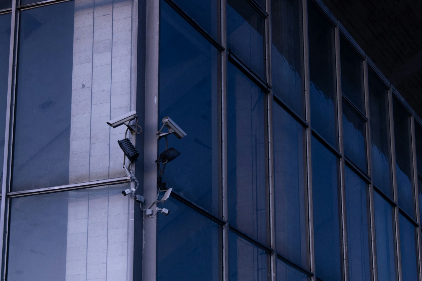 Cameras on a building for a commercial security system 