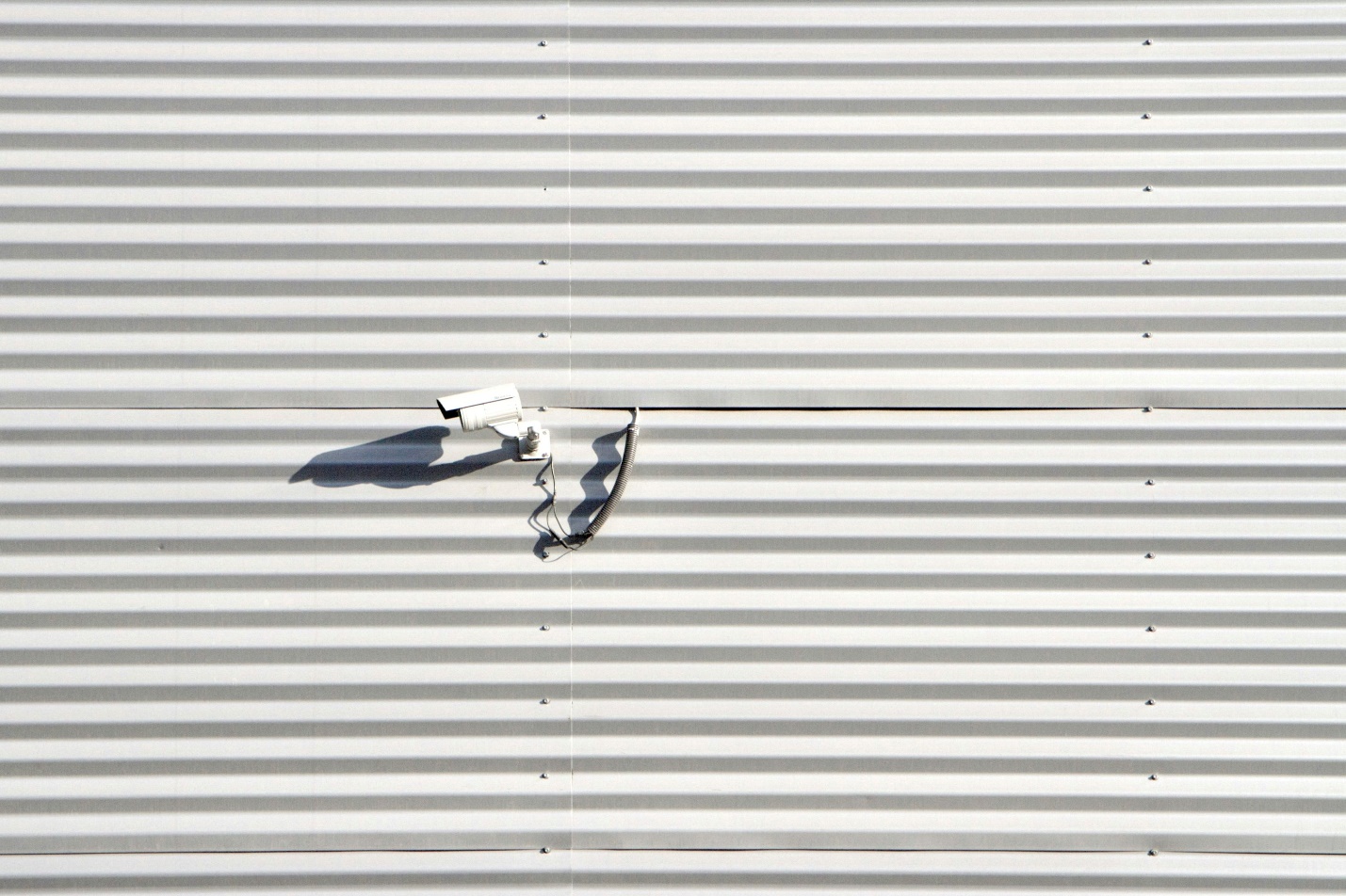 A camera on a building for a commercial security system