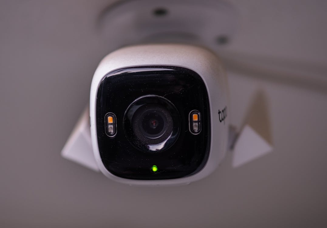 A close-up of a modern security camera in action, showcasing its real-time surveillance capabilities.