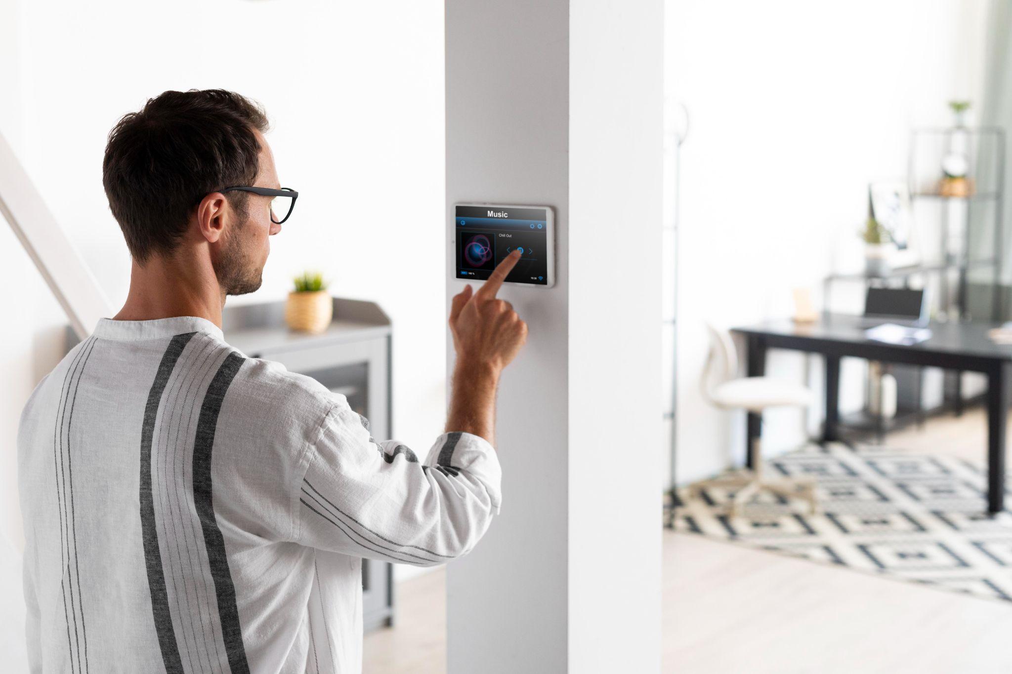 A person interacting with an alarm system