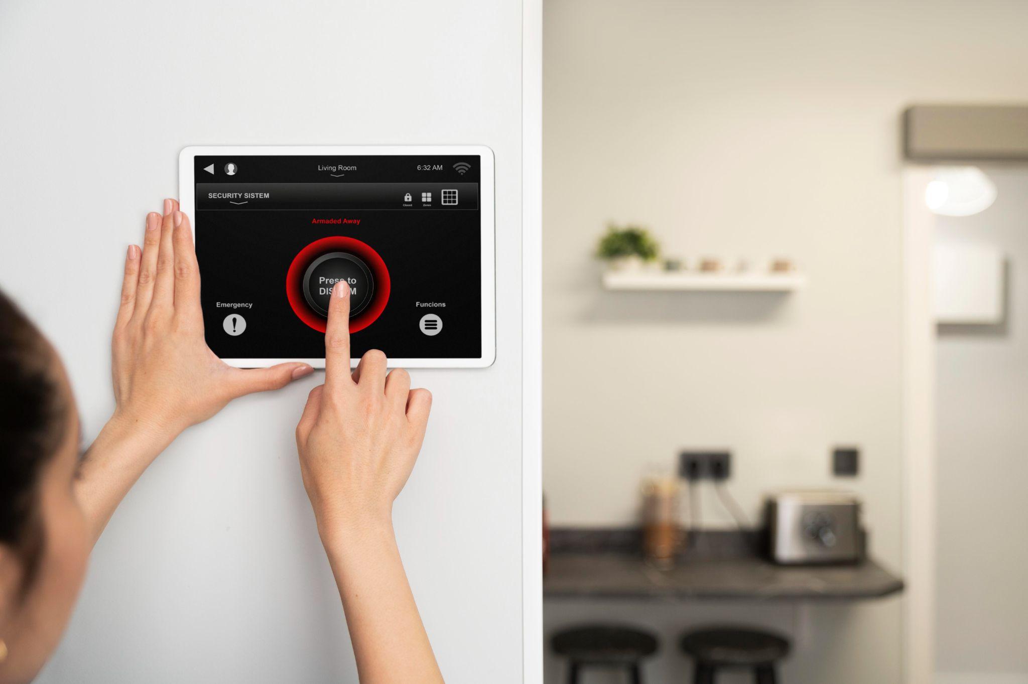 A person using a modern alarm system