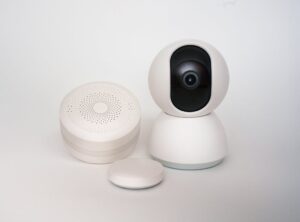 A collection of smart home devices, including a security camera, showcasing the integration of modern security technology in home automation.
