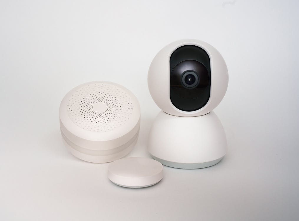 A collection of smart home devices, including a security camera, showcasing the integration of modern security technology in home automation.